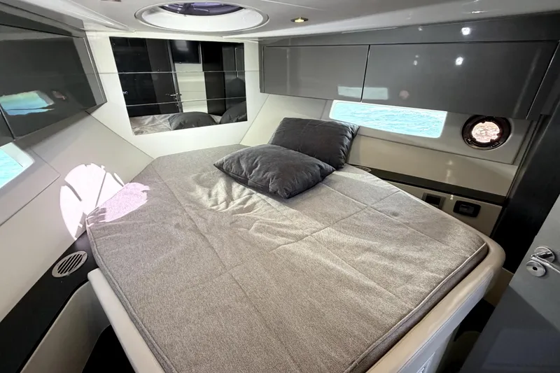Slide: The Image of Luxurious cabin interior of 2024 Schaefer 400 yacht with modern design and comfortable bedding. - 18