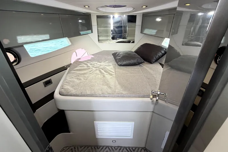 Slide: The Image of Luxurious cabin interior of 2024 Schaefer 400 yacht with modern bedding and sleek design. - 19
