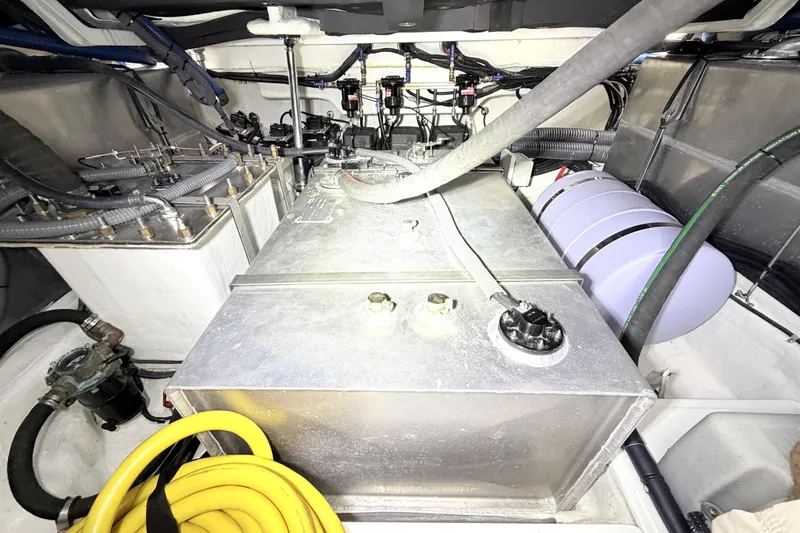 Slide: The Image of Engine room of a 2024 Schaefer 400 yacht, showcasing fuel tanks and wiring. - 24