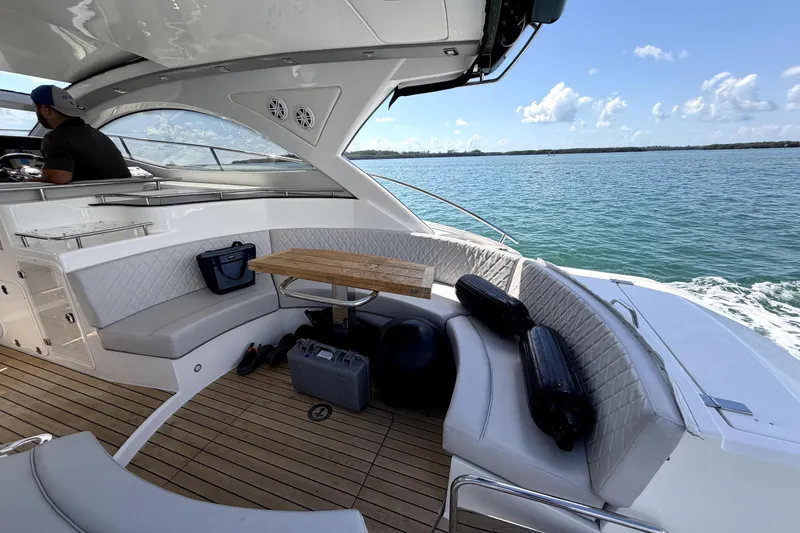 Slide: The Image of Luxurious 2024 Schaefer 400 yacht interior with seating, table, and ocean view. - 4