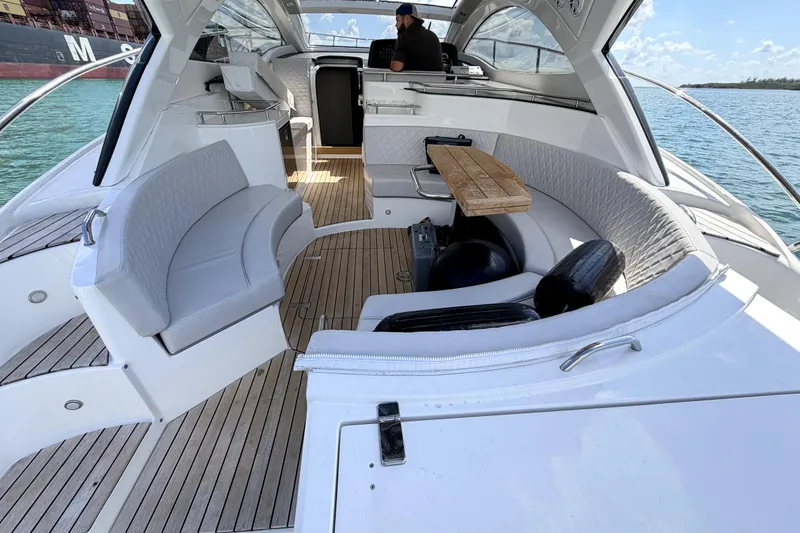 Slide: The Image of Luxurious 2024 Schaefer 400 yacht interior with elegant seating and wooden flooring. - 5