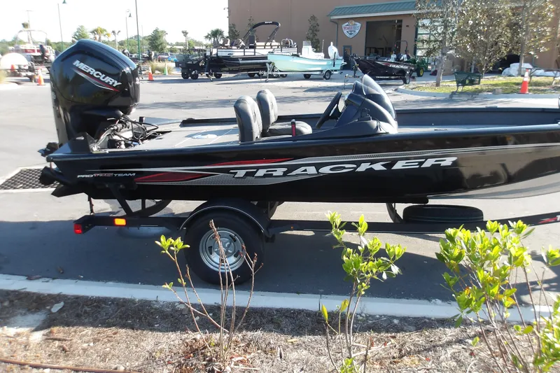 Slide: The Image of 2023 Tracker Pro Team 175 TXW boat on trailer, parked outdoors. - 3