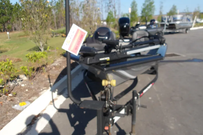 Slide: The Image of 2023 Tracker Pro Team 175 TXW boat on trailer in outdoor setting. - 4