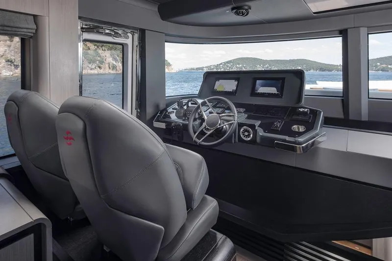 Slide: The Image of Modern helm of 2025 Sirena 58 yacht with dual seats and advanced navigation systems. - 10