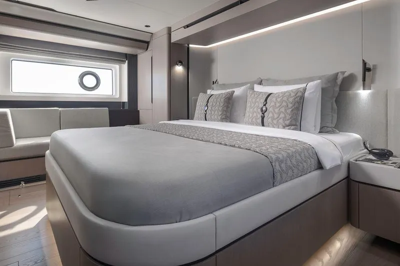 Slide: The Image of Luxurious bedroom interior of 2025 Sirena 58 yacht with modern design and elegant bedding. - 11