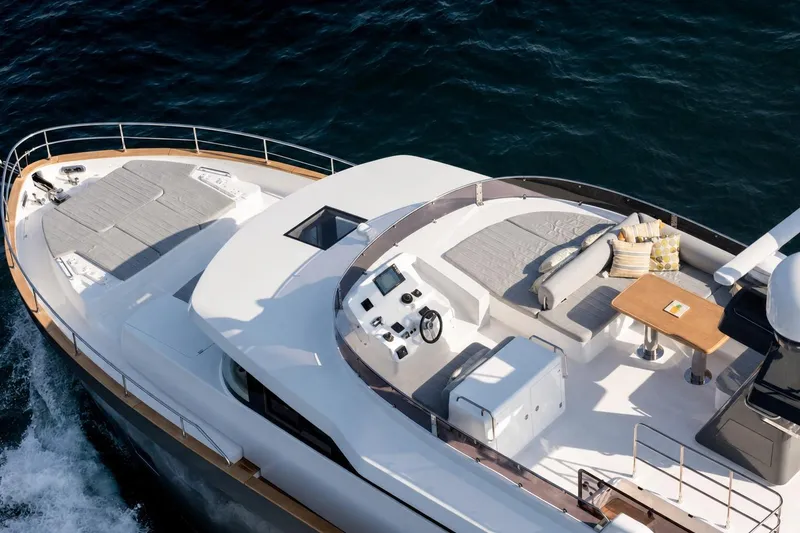 Slide: The Image of Luxurious 2025 Sirena 58 yacht with spacious deck and elegant seating area. - 4