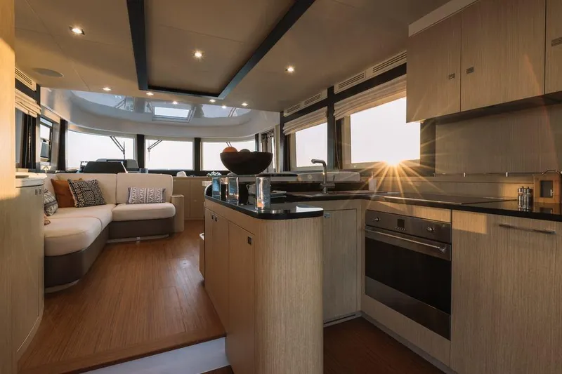 Slide: The Image of Luxurious interior of 2025 Sirena 58 yacht with modern kitchen and cozy seating area. - 6