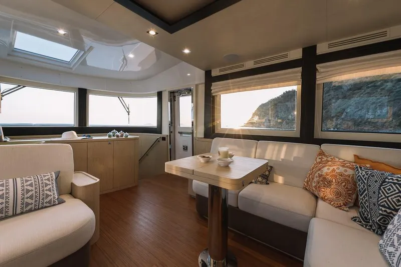 Slide: The Image of Luxurious interior of 2025 Sirena 58 yacht with elegant seating and scenic views. - 7