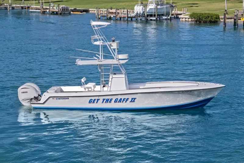 The Image of 2002 Contender 31 Open boat on water, featuring Yamaha engine and sleek design. - 0