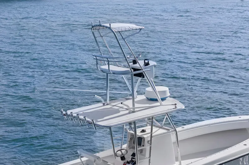 Slide: The Image of 2002 Contender 31 Open boat with tower on calm water. - 10