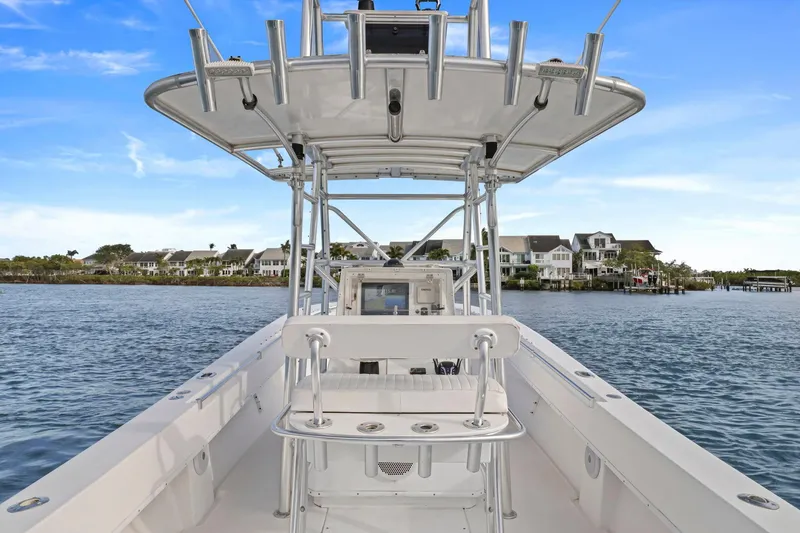 Slide: The Image of 2002 Contender 31 Open boat on water, featuring a sleek design and spacious deck. - 18