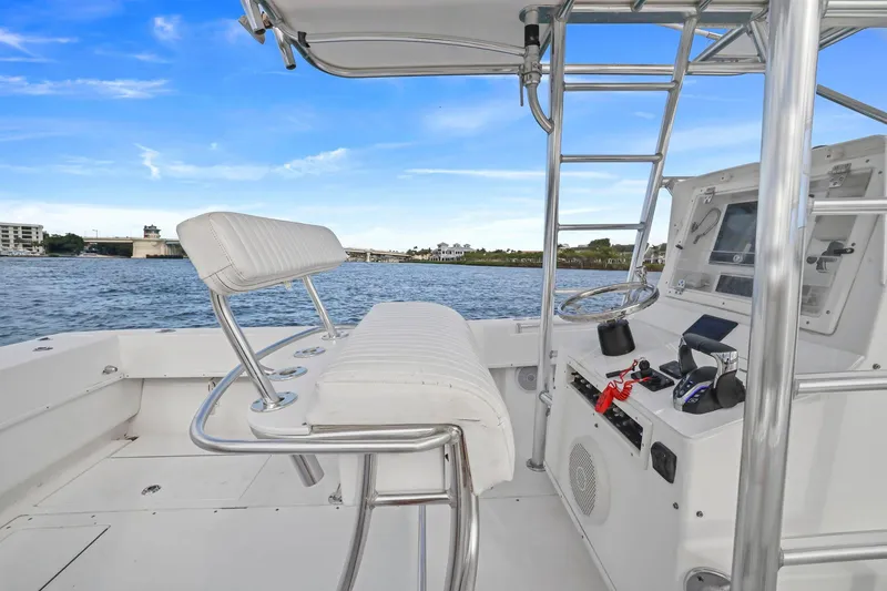 Slide: The Image of 2002 Contender 31 Open boat interior with helm, seating, and ocean view. - 21