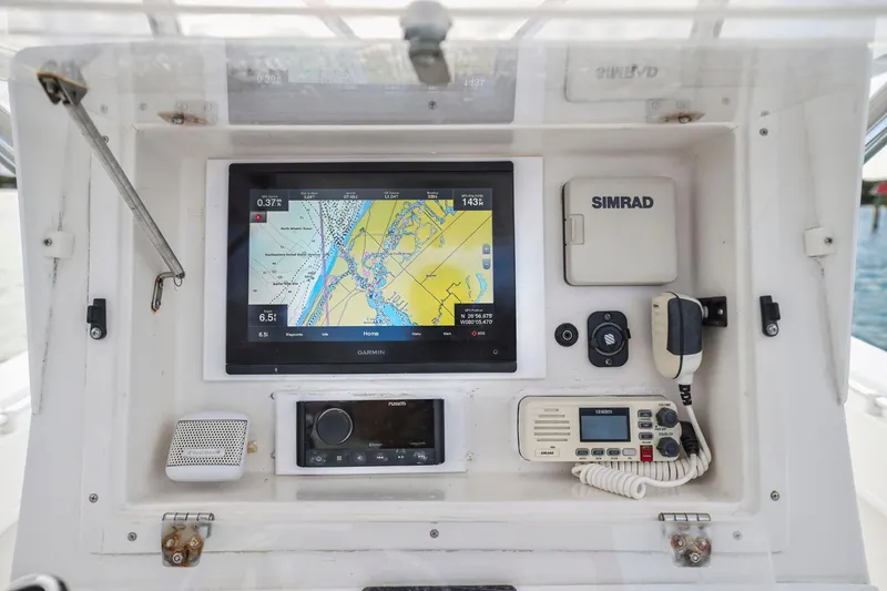 Slide: The Image of Console of 2002 Contender 31 Open boat with navigation and communication equipment. - 24