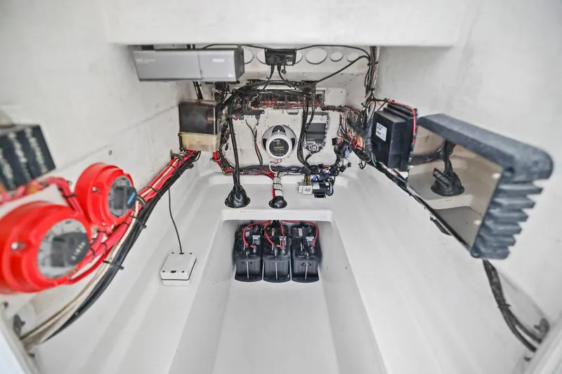Slide: The Image of Electrical wiring and components inside a 2002 Contender 31 Open boat. - 35