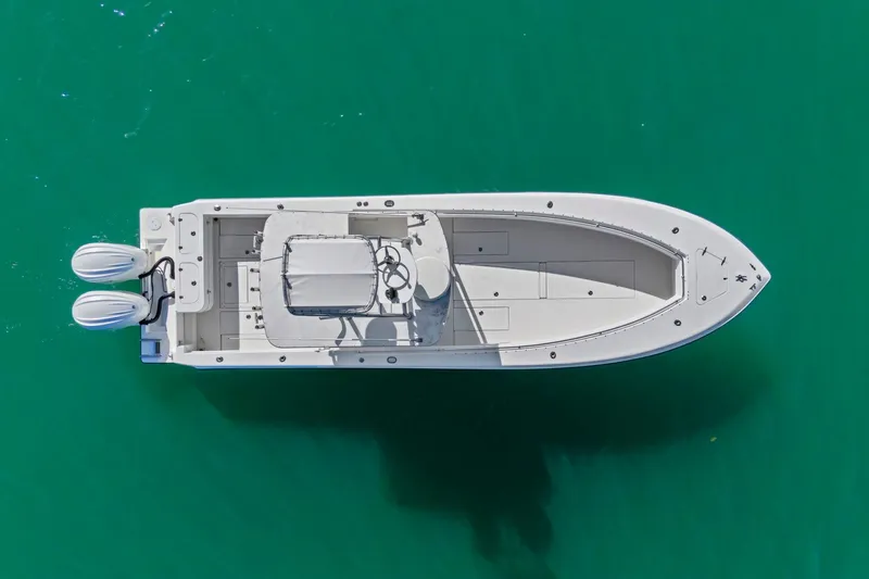 Slide: The Image of Aerial view of 2002 Contender 31 Open boat on turquoise water. - 9