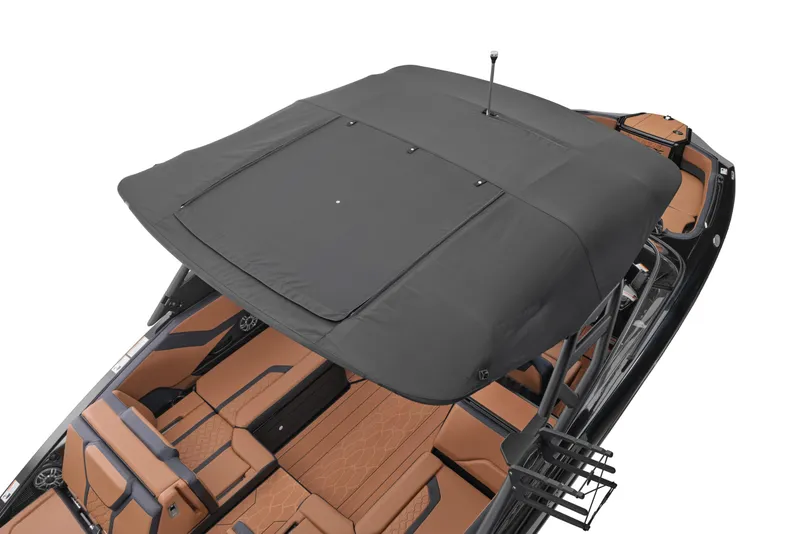 Slide: The Image of 2026 Yamaha Boats 255XD with black canopy and luxurious tan seating. - 17