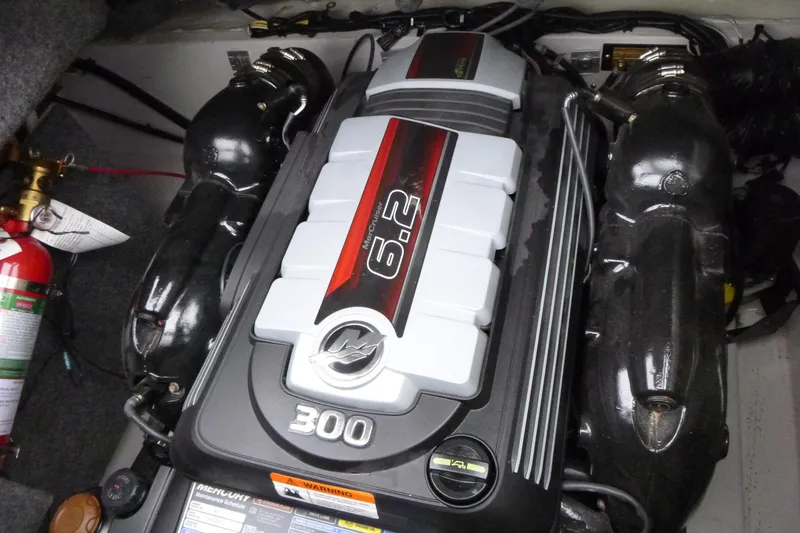 Slide: The Image of Engine compartment of a 2017 Four Winns H260 boat featuring a 6.2L MerCruiser engine. - 12