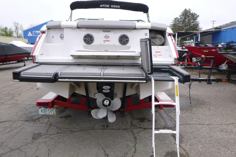 Slide: The Image of Rear view of 2017 Four Winns H260 boat with swim platform and ladder. - 5