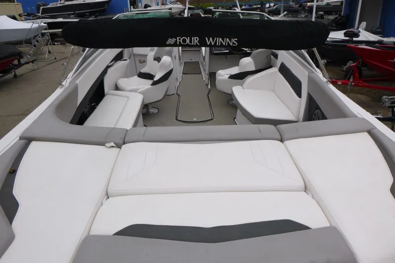 Slide: The Image of 2017 Four Winns H260 boat interior with spacious seating and sleek design. - 6