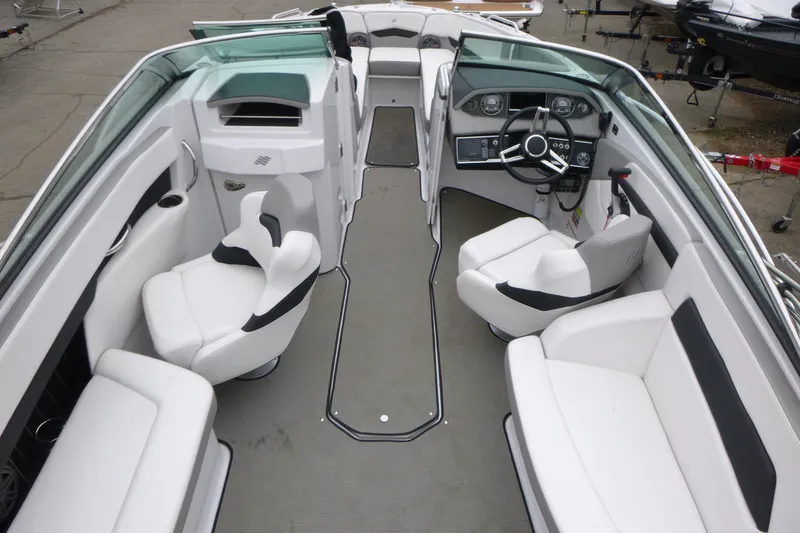 Slide: The Image of 2017 Four Winns H260 boat interior with white seating and modern dashboard. - 7