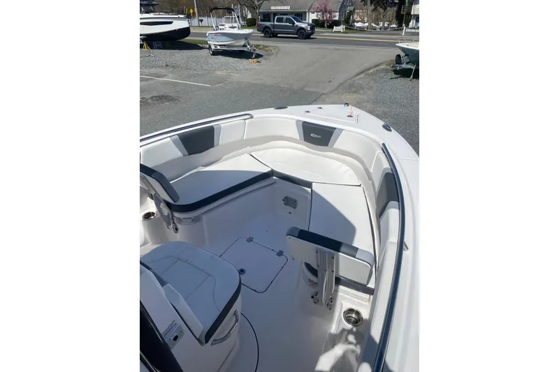 Slide: The Image of 2023 Robalo R230 Center Console boat interior with seating and console view. - 4