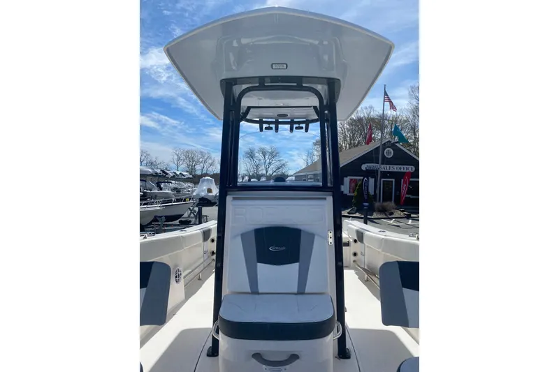 Slide: The Image of 2023 Robalo R230 Center Console boat with sleek design at a sales office. - 6