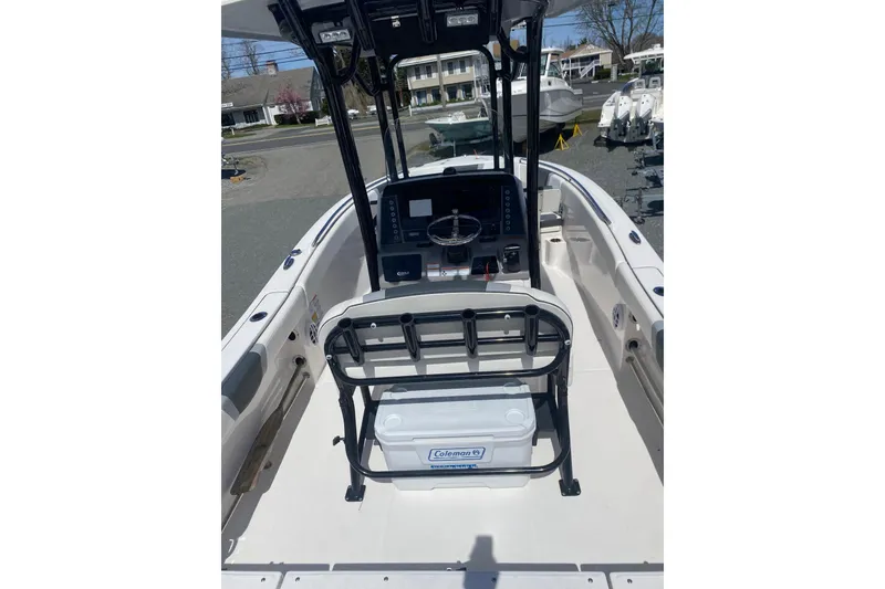 Slide: The Image of 2023 Robalo R230 Center Console boat interior with steering console and seating. - 9