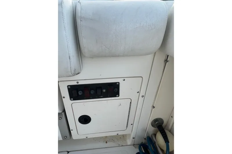 Slide: The Image of Control panel on a 1998 Boston Whaler Outrage 23 boat interior. - 13