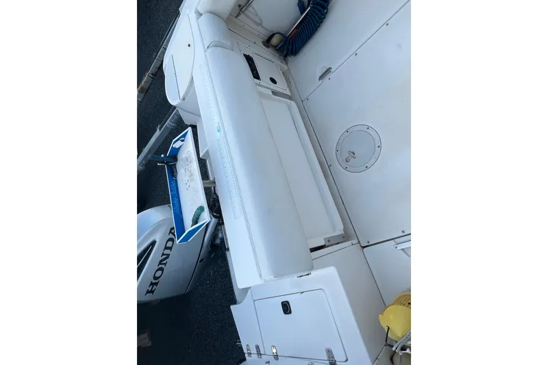 Slide: The Image of 1998 Boston Whaler Outrage 23 boat interior with Honda outboard motor. - 17