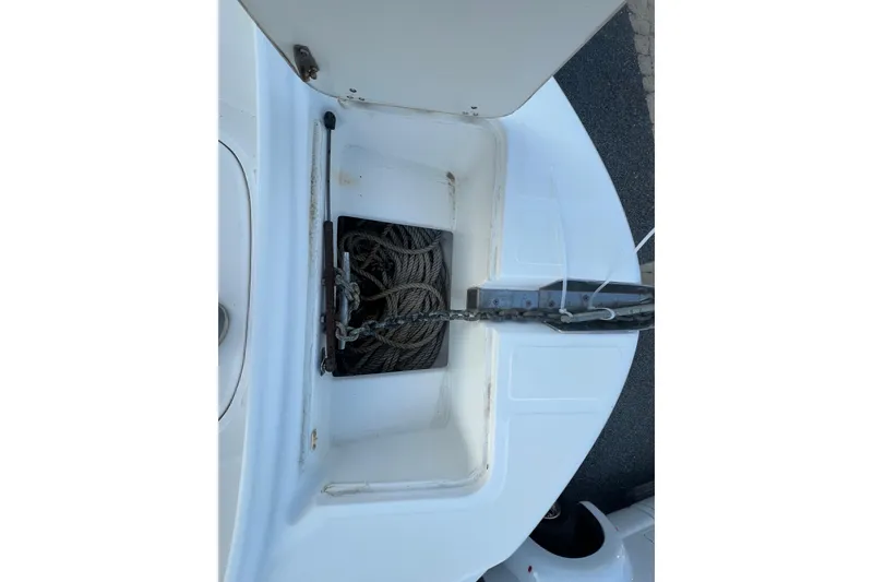 Slide: The Image of Anchor storage compartment on a 1998 Boston Whaler Outrage 23 boat. - 9