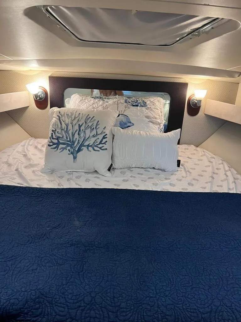 Slide: The Image of Cozy bedroom in 2015 Regal 35 Sport Coupe with nautical-themed decor. - 18
