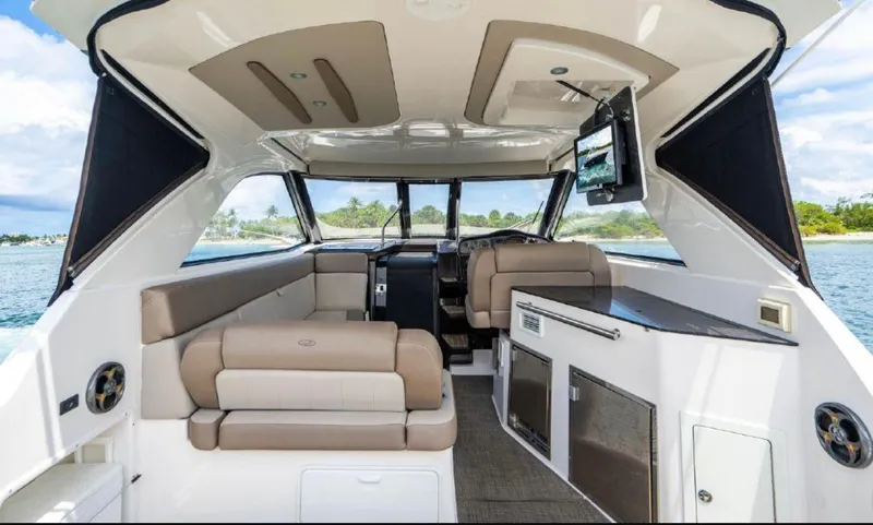 Slide: The Image of Interior of 2015 Regal 35 Sport Coupe yacht with modern seating and amenities. - 2