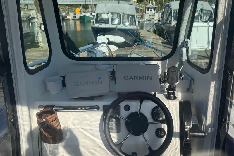 Slide: The Image of Interior view of a 2022 Bullfrog 17ft Pilot House boat with Garmin navigation system. - 4