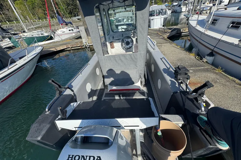 Slide: The Image of 2022 Bullfrog 17ft Pilot House boat docked at a marina with Honda engine. - 5