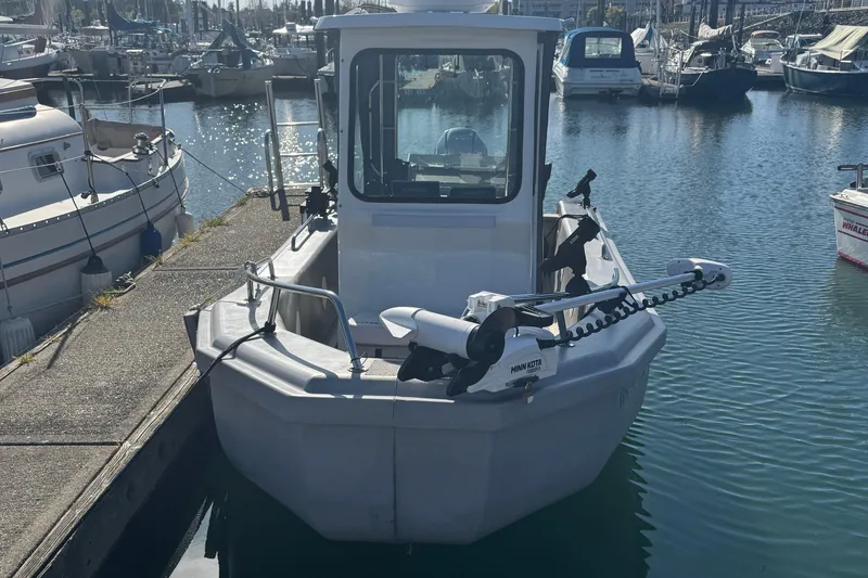 Slide: The Image of 2022 Bullfrog 17ft Pilot House boat docked in marina. - 6