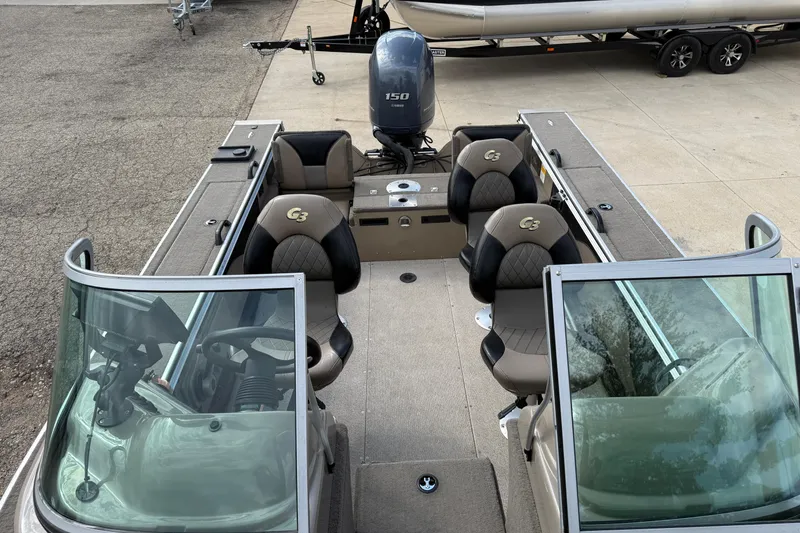 Slide: The Image of 2013 G3 Angler V185 SF boat interior with seating and steering console. - 10