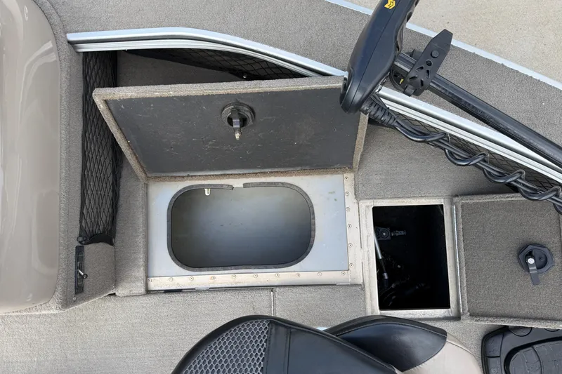 Slide: The Image of Open storage compartments on a 2013 G3 Angler V185 SF boat deck. - 13
