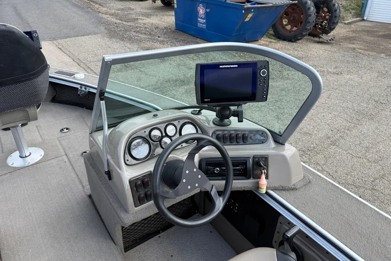 Slide: The Image of 2013 G3 Angler V185 SF boat dashboard with steering wheel and navigation system. - 17