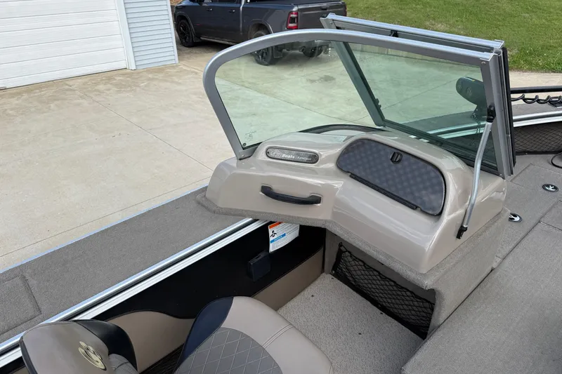 Slide: The Image of 2013 G3 Angler V185 SF boat interior with windshield and seating area. - 19