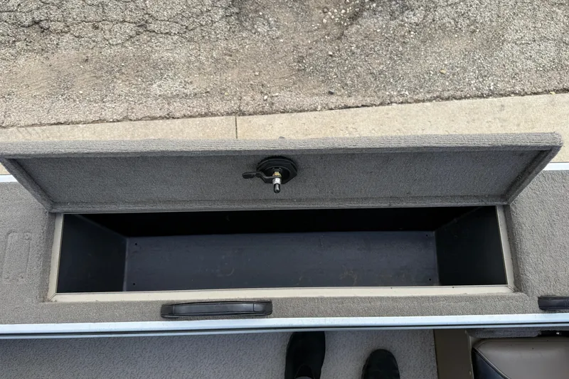 Slide: The Image of Open storage compartment on 2013 G3 Angler V185 SF boat, showing interior space. - 25