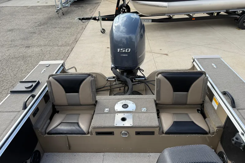 Slide: The Image of 2013 G3 Angler V185 SF boat with Yamaha 150 engine, dual seats, and storage compartments. - 26