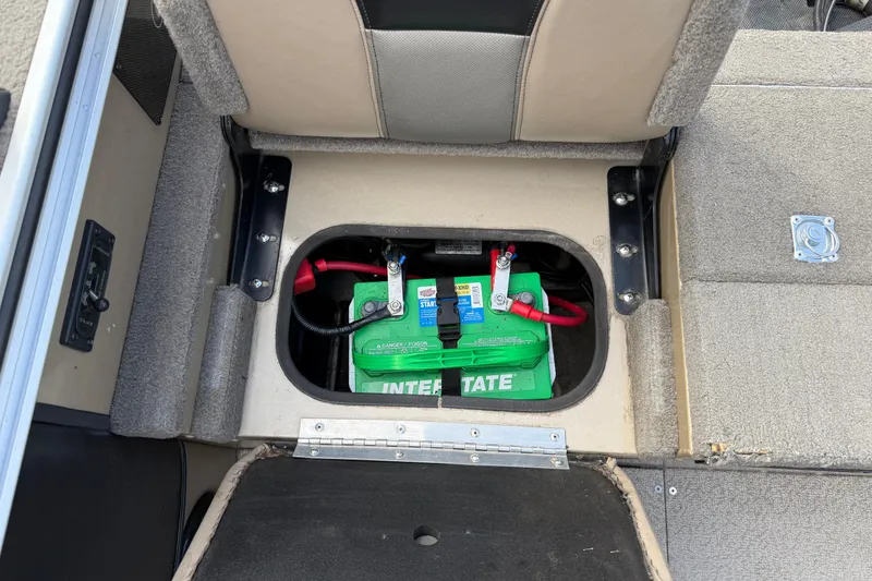 Slide: The Image of 2013 G3 Angler V185 SF boat battery compartment with green Interstate battery. - 28