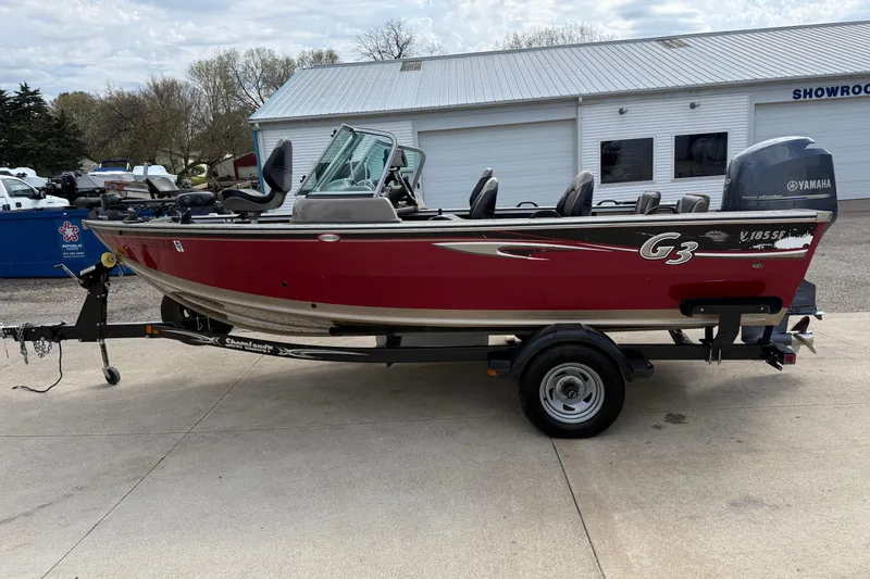 Slide: The Image of 2013 G3 Angler V185 SF boat on trailer, parked outside showroom. - 3
