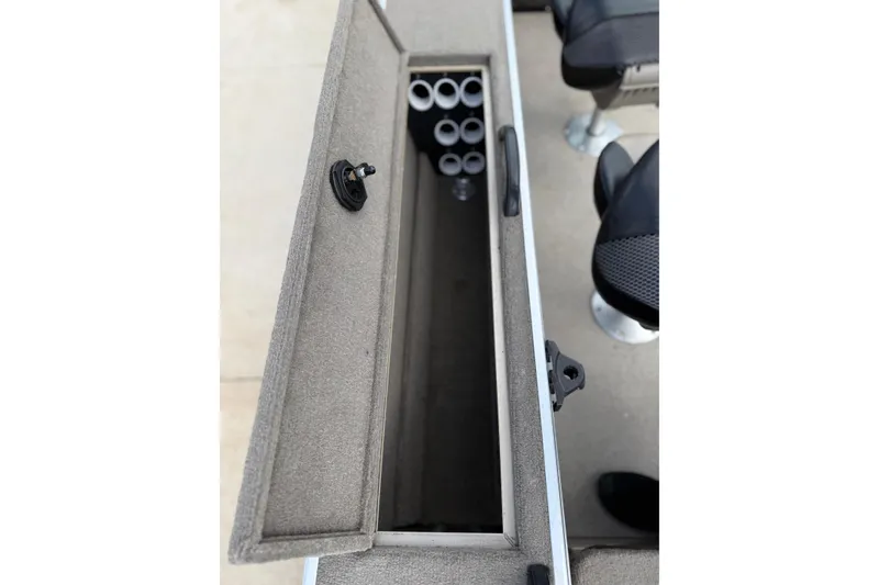 Slide: The Image of 2013 G3 Angler V185 SF boat storage compartment with rod holders and seating. - 32
