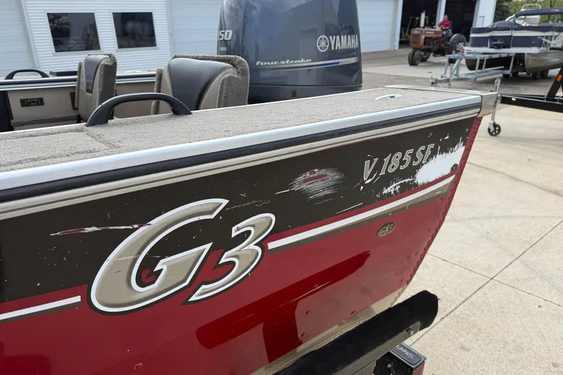 Slide: The Image of 2013 G3 Angler V185 SF boat with Yamaha engine, showing exterior wear. - 35