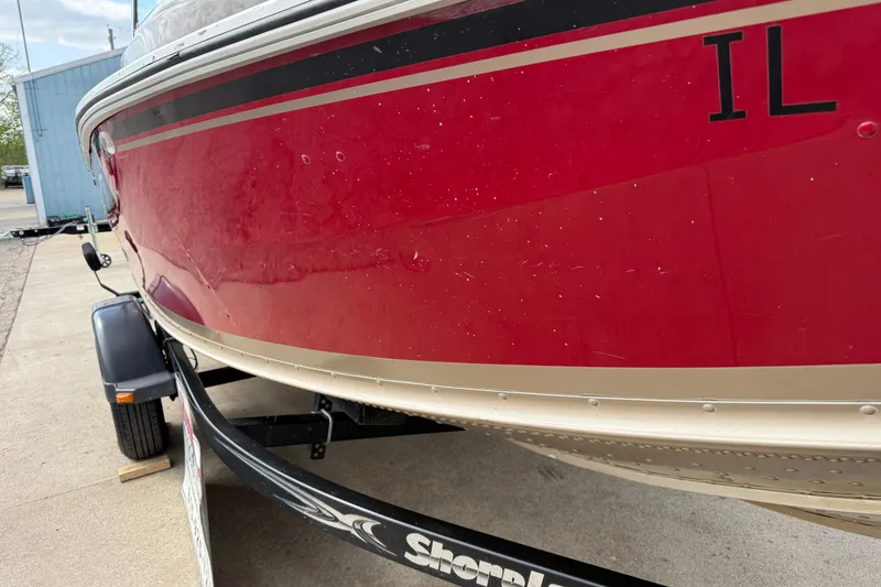 Slide: The Image of Red 2013 G3 Angler V185 SF boat on trailer, parked outdoors. - 38