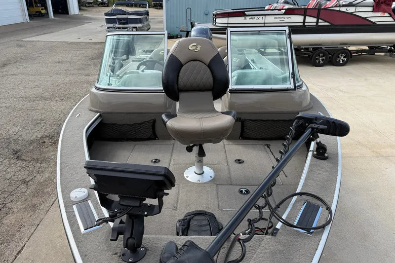 Slide: The Image of 2013 G3 Angler V185 SF fishing boat with seating and equipment on deck. - 7
