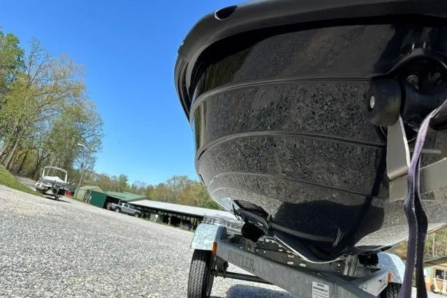Slide: The Image of 2012 Kawasaki Jetski Ultra LX on trailer, parked outdoors under clear blue sky. - 10