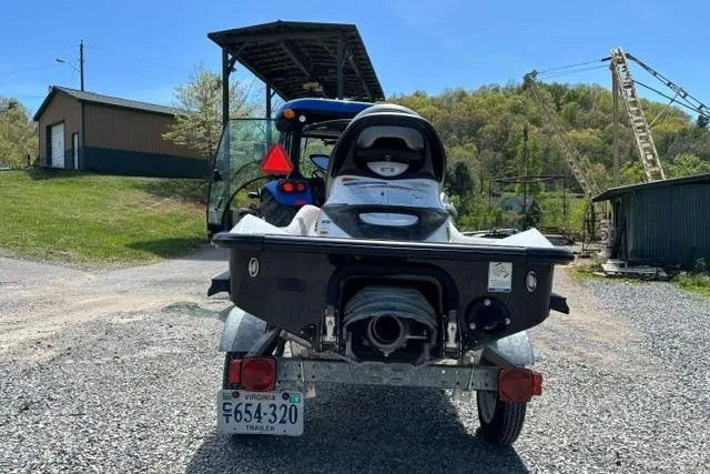Slide: The Image of 2012 Kawasaki Jetski Ultra LX on trailer, parked outdoors with scenic background. - 3