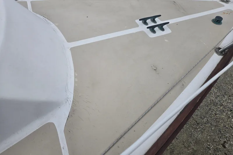 Slide: The Image of Deck of 1989 Cape Dory 27 sailboat with cleats and textured surface. - 10